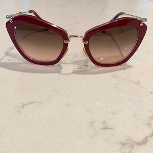 Miu Miu cateye sunglasses in burgundy.